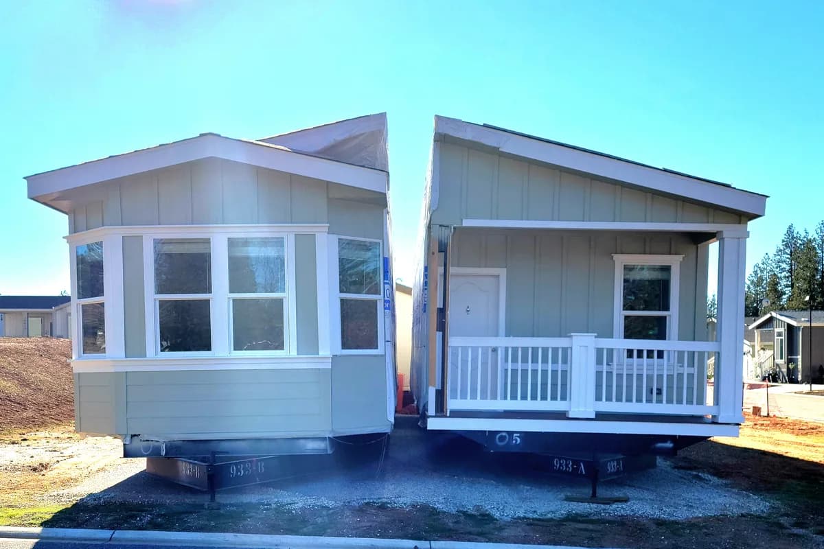 Double-wide manufactured home sections on pier supports during setup — mobile home leveling in Bakersfield, CA